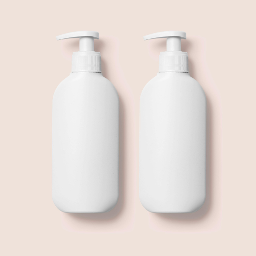 two pump bottles on a cream background