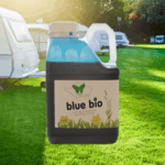 large bottle of blue bio in front of a caravan site