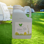 large bottle of blue bio in front of a caravan site