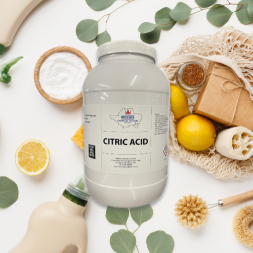 tub of citric acid in front of a range of eco friendly cleaning products