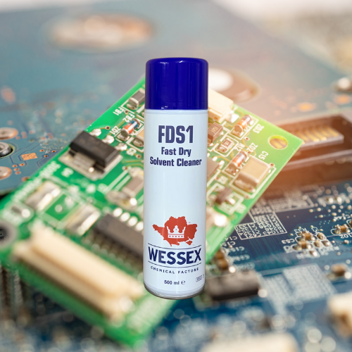 spray can of FDS1 in front of a green circuit board