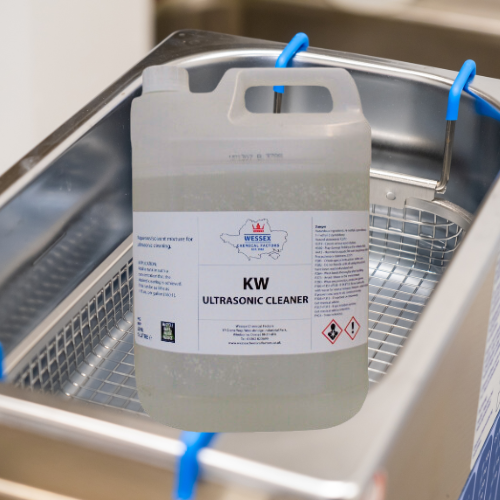 bottle of kw ultrasonic cleaner in front of an ultrasonic bath
