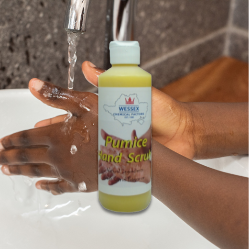 bottle of pumice hand scrub in front of person washing their hands