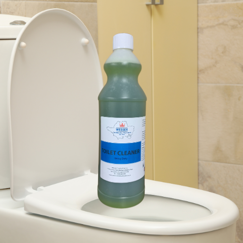 Bottle of toilet cleaner in front of a toilet